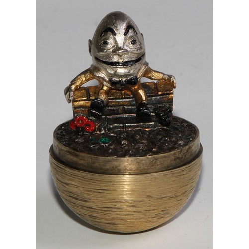 1254 - Stuart Devlin (1931 - 2018) - an Elizabeth II silver-gilt Surprise Egg, Humpty Dumpty, textured over... 