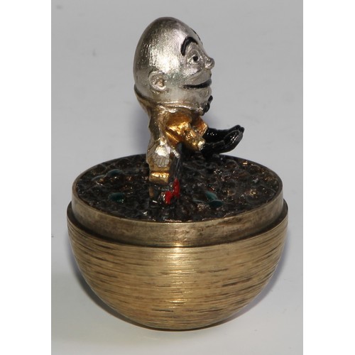 1254 - Stuart Devlin (1931 - 2018) - an Elizabeth II silver-gilt Surprise Egg, Humpty Dumpty, textured over... 