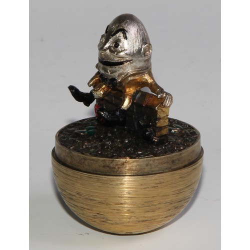 1254 - Stuart Devlin (1931 - 2018) - an Elizabeth II silver-gilt Surprise Egg, Humpty Dumpty, textured over... 