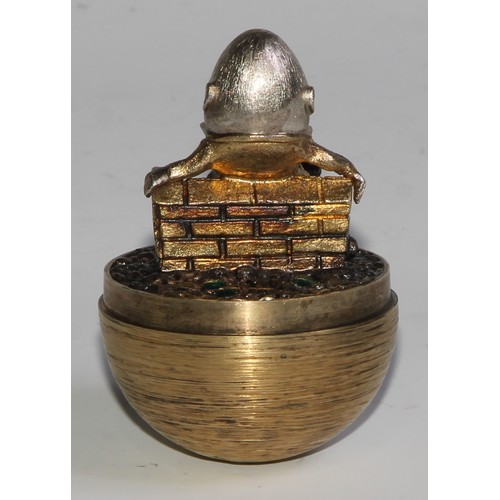 1254 - Stuart Devlin (1931 - 2018) - an Elizabeth II silver-gilt Surprise Egg, Humpty Dumpty, textured over... 