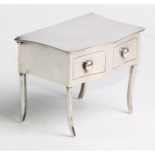 964 - A George V silver novelty dressing table jewellery box, as a serpentine side table, hinged cover abo... 