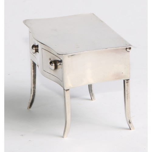 964 - A George V silver novelty dressing table jewellery box, as a serpentine side table, hinged cover abo... 