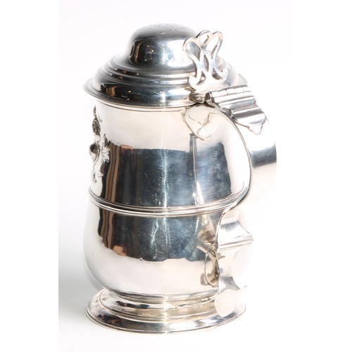 913 - A George III silver baluster tankard, hinged domed cover, chair-back thumbpiece, double-scroll handl... 