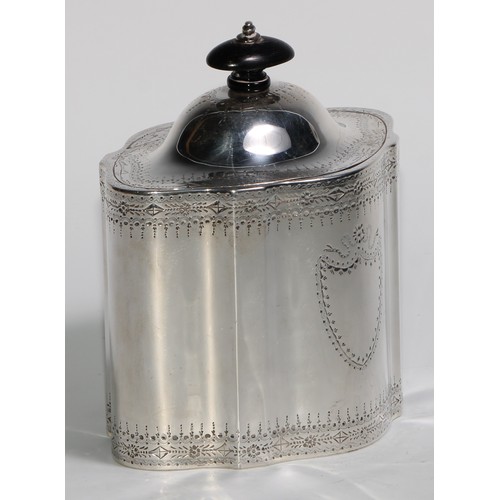 920 - A George III silver commode shaped tea caddy, bright-cut and wrigglework engraved, hinged domed cove... 