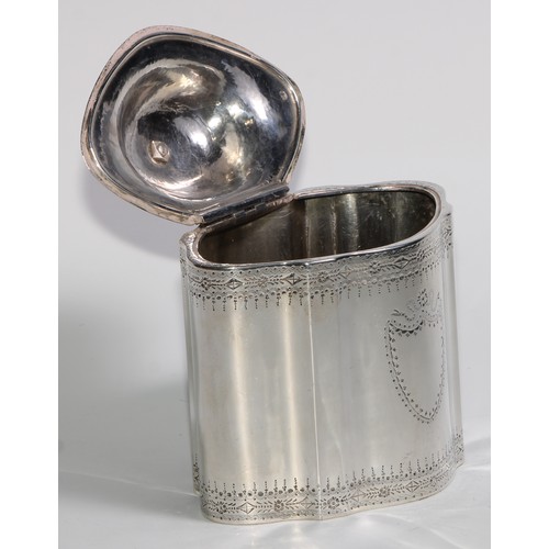 920 - A George III silver commode shaped tea caddy, bright-cut and wrigglework engraved, hinged domed cove... 