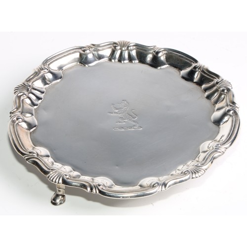 1025 - A pair of George II silver shaped circular salvers, fluted shell and C-scroll borders, pad feet,  16... 