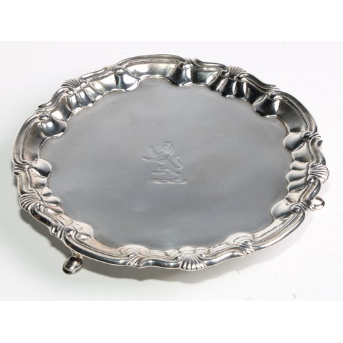 1025 - A pair of George II silver shaped circular salvers, fluted shell and C-scroll borders, pad feet,  16... 