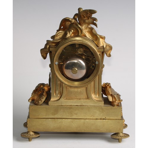 1754 - A French gilt brass mantel clock, crested with a pair of lovebirds and flaming torch, the white enam... 