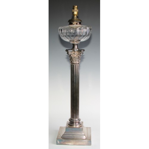 818 - A late Victorian/Edwardian E.P.N.S Corinthian column table oil lamp, faceted glass reservoir, steppe... 