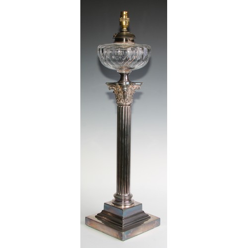 818 - A late Victorian/Edwardian E.P.N.S Corinthian column table oil lamp, faceted glass reservoir, steppe... 