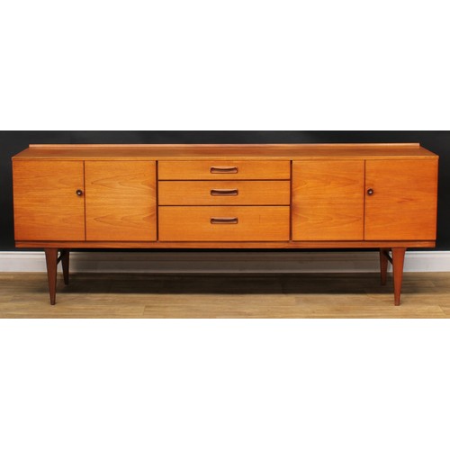 2070 - Mid-century Design - a teak sideboard, by Nathan, rectangular top with shallow half-gallery above th... 