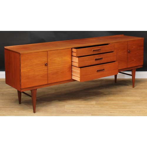 2070 - Mid-century Design - a teak sideboard, by Nathan, rectangular top with shallow half-gallery above th... 