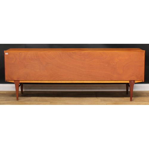 2070 - Mid-century Design - a teak sideboard, by Nathan, rectangular top with shallow half-gallery above th... 