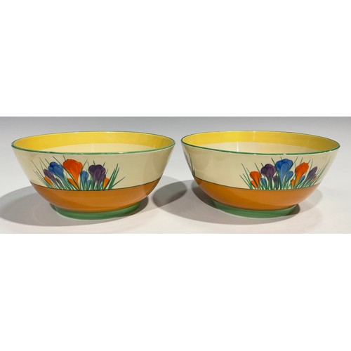 15 - A pair of Clarice Cliff Crocus pattern bowls, hand painted in bright colours, 22.5cm diameter, print... 