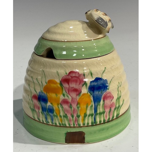 14 - A Clarice Cliff Spring Crocus pattern ribbed domed honey pot and cover, the cover with bee knop, 10c... 