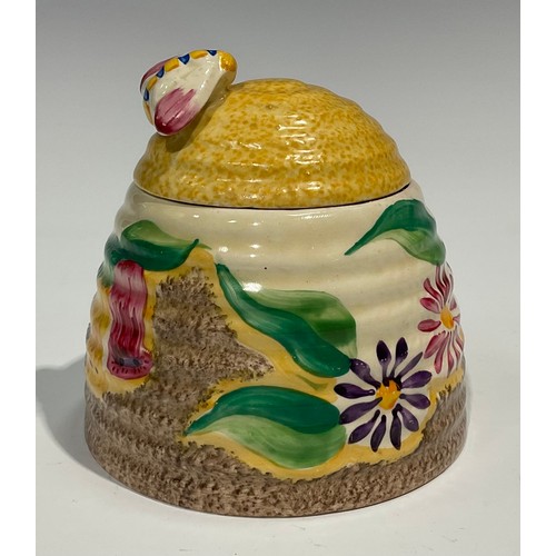 4 - A Clarice Cliff Bizarre Fantasque Petunia pattern ribbed domed honey pot and cover, painted with bri... 