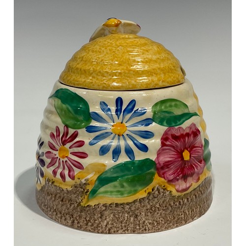 4 - A Clarice Cliff Bizarre Fantasque Petunia pattern ribbed domed honey pot and cover, painted with bri... 