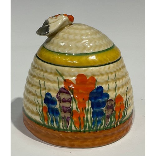 1 - A Clarice Cliff Bizarre Blue Crocus pattern ribbed honey pot and cover, the moulded basketweave cove... 