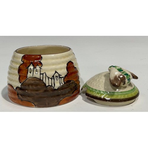 2 - A Clarice Cliff Bizarre Fantasque Alton pattern ribbed honey pot and cover, the moulded basketweave ... 