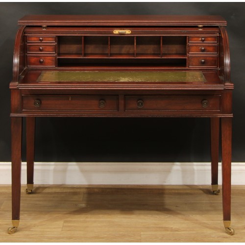 2565 - A Sheraton style mahogany cylinder desk, retractable tambour door enclosing a sliding plateau with i... 