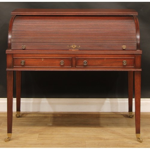 2565 - A Sheraton style mahogany cylinder desk, retractable tambour door enclosing a sliding plateau with i... 