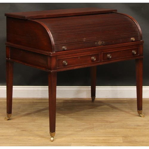 2565 - A Sheraton style mahogany cylinder desk, retractable tambour door enclosing a sliding plateau with i... 