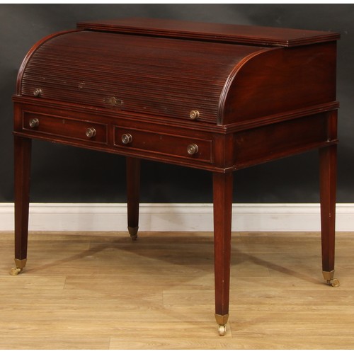 2565 - A Sheraton style mahogany cylinder desk, retractable tambour door enclosing a sliding plateau with i... 