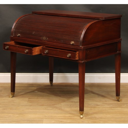 2565 - A Sheraton style mahogany cylinder desk, retractable tambour door enclosing a sliding plateau with i... 