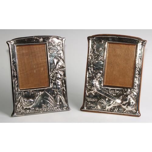 1825 - A pair of Art Nouveau period silver plated easel novelty photograph frames, embossed in the manner o... 