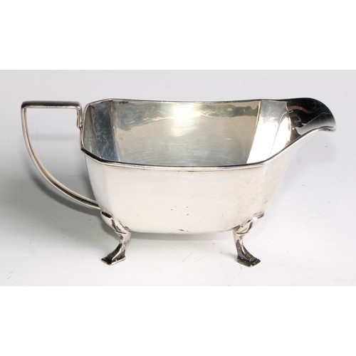 952 - A George V Art silver Art Deco four piece tea service, angular handles, pad feet, Cooper Brothers & ... 