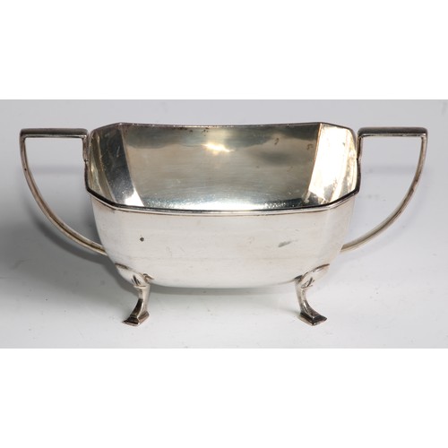 952 - A George V Art silver Art Deco four piece tea service, angular handles, pad feet, Cooper Brothers & ... 