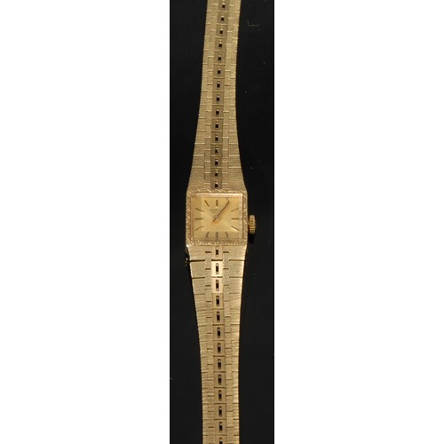 1282 - A 9ct gold Marvin Revue ladies wristwatch, square  champagne dial, baton hour markers, articulated s... 