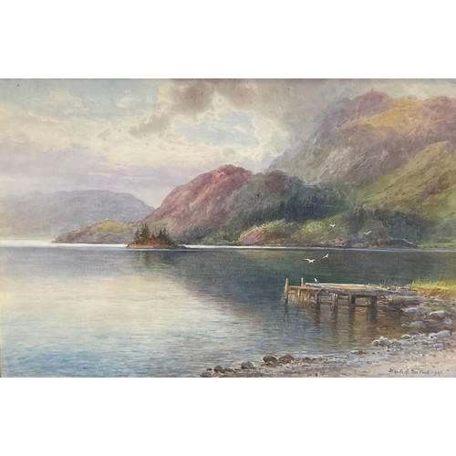 544 - Emile A. Stock 
Tranquil Reflections on the Loch, 
signed, dated 1907, 34cm x 52cm.