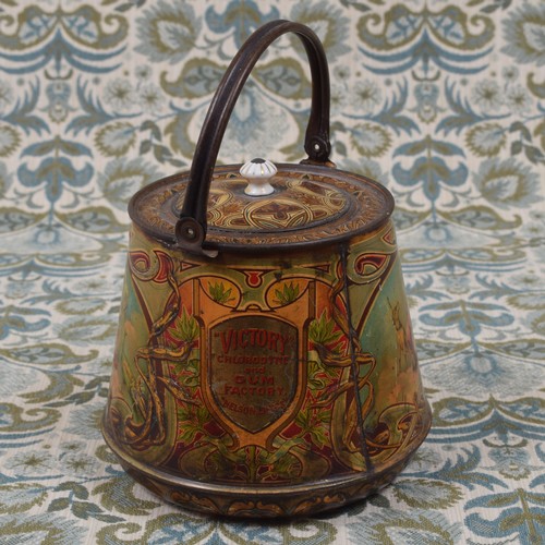 6207 - Advertising - an early 20th century pictorial confectionery tin in the form of a biscuit barrel, lit... 