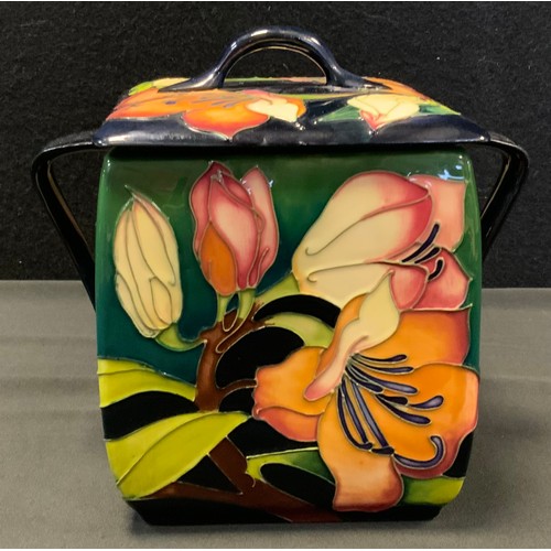 19 - A contemporary Moorcroft pottery square twin-handled biscuit barrel and cover, tube lined in the Pen... 