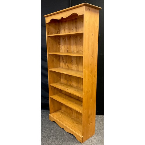 79 - A Pine open bookcase, five tiers of adjustable shelving, 182cm high x 91cm wide x 30.5cm.