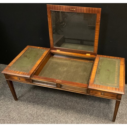 83 - A 20th century mahogany Bijouterie centre coffee table, tooled green leather inset top, lift-up glaz... 