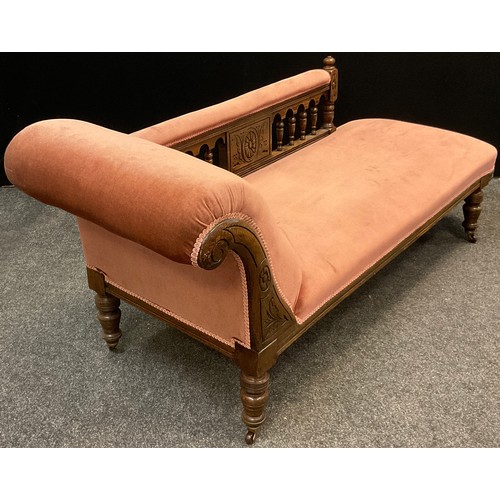 112 - A Victorian oak scroll-end Chaise Longue, carved scroll, turned supports with ceramic casters, uphol... 