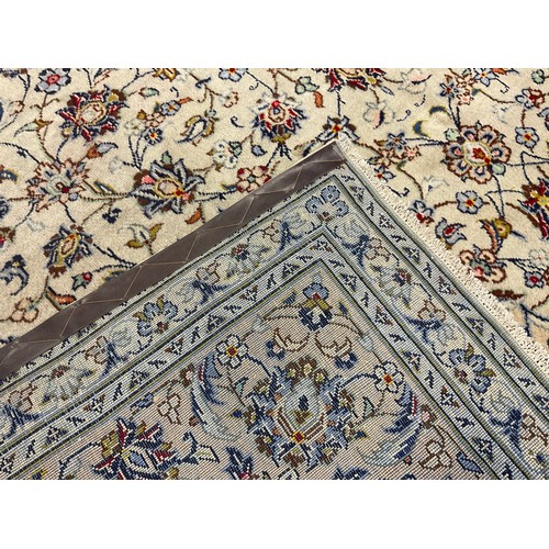 115 - A Central Persian Kashan carpet / rug, knotted in pale cream, blue and red, the intricate central me... 