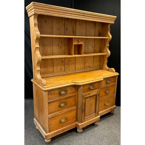 143 - A Victorian Pine Dresser, plate-rack top with single small drawer and cubby-hole to centre, a centra... 