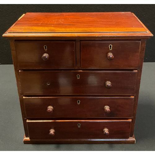 148 - A late 19th century mahogany table-top collector’s chest, two short over three long drawers,