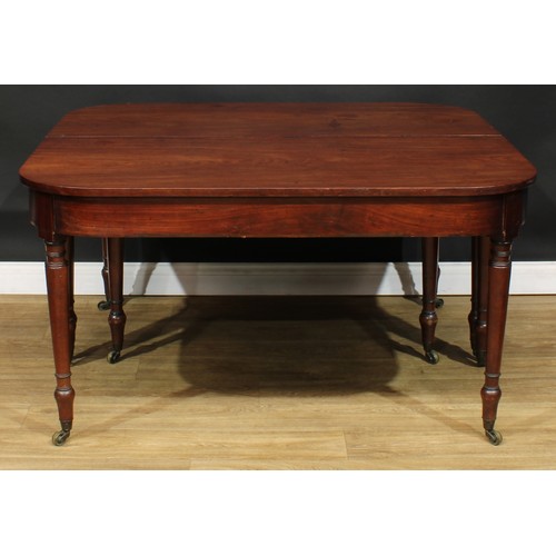 318 - A George III mahogany D-end dining table, one additional leaf, turned legs, brass casters, 71cm high... 