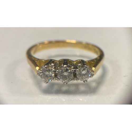 546 - A diamond ring, linear set with three round brilliant cut diamonds, total estimated diamond weight a... 