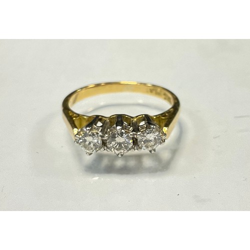 546 - A diamond ring, linear set with three round brilliant cut diamonds, total estimated diamond weight a... 