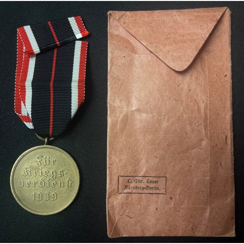 4038 - WW2 Third Reich Kriegsverdienstmedaille - War Merit Medal complete with ribbon in original packet of... 