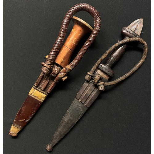 4056 - Two African Sleeve Daggers: one with gold painted wooden grip with 134mm long double edged blade, ov... 