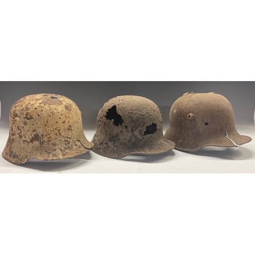 4109 - WW1 Imperial German Three M16 Steel Helmets in Relic Battlefield Recovered Condition. (3)