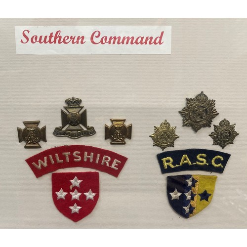 4209 - WW2 British framed display of 19 Southern Command Regiments and Corps formation signs, shoulder titl... 