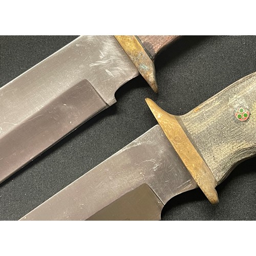 4268 - Two handmade and forged Bowie Knives: one with 200mm long blade and brass crossguard and straight wo... 