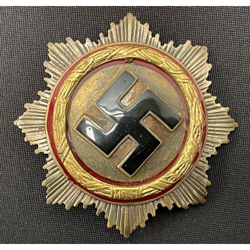 4369 - Reproduction German Cross in Gold in case, German Cross in Silver and a cloth German Cross. (3)